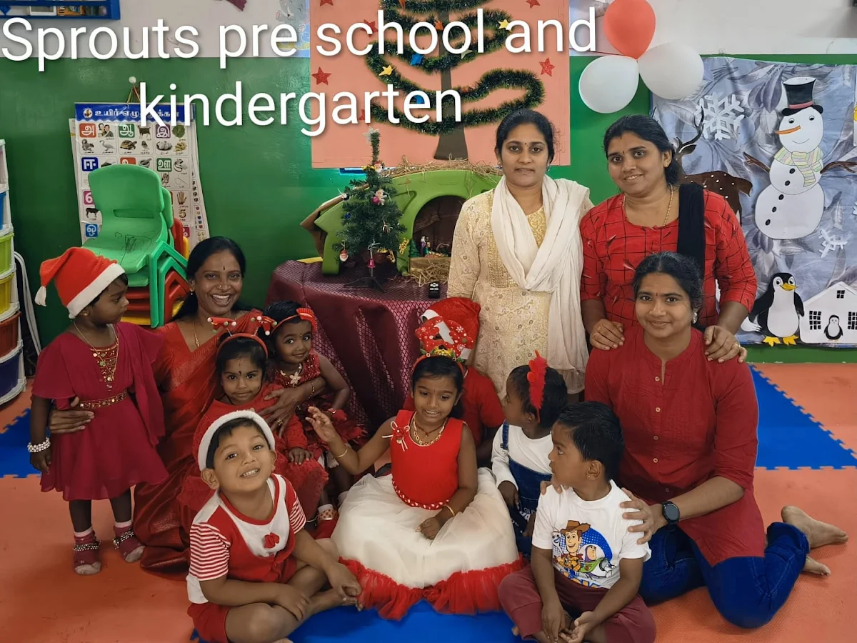 Kids showing their artwork at Sprouts Preschool